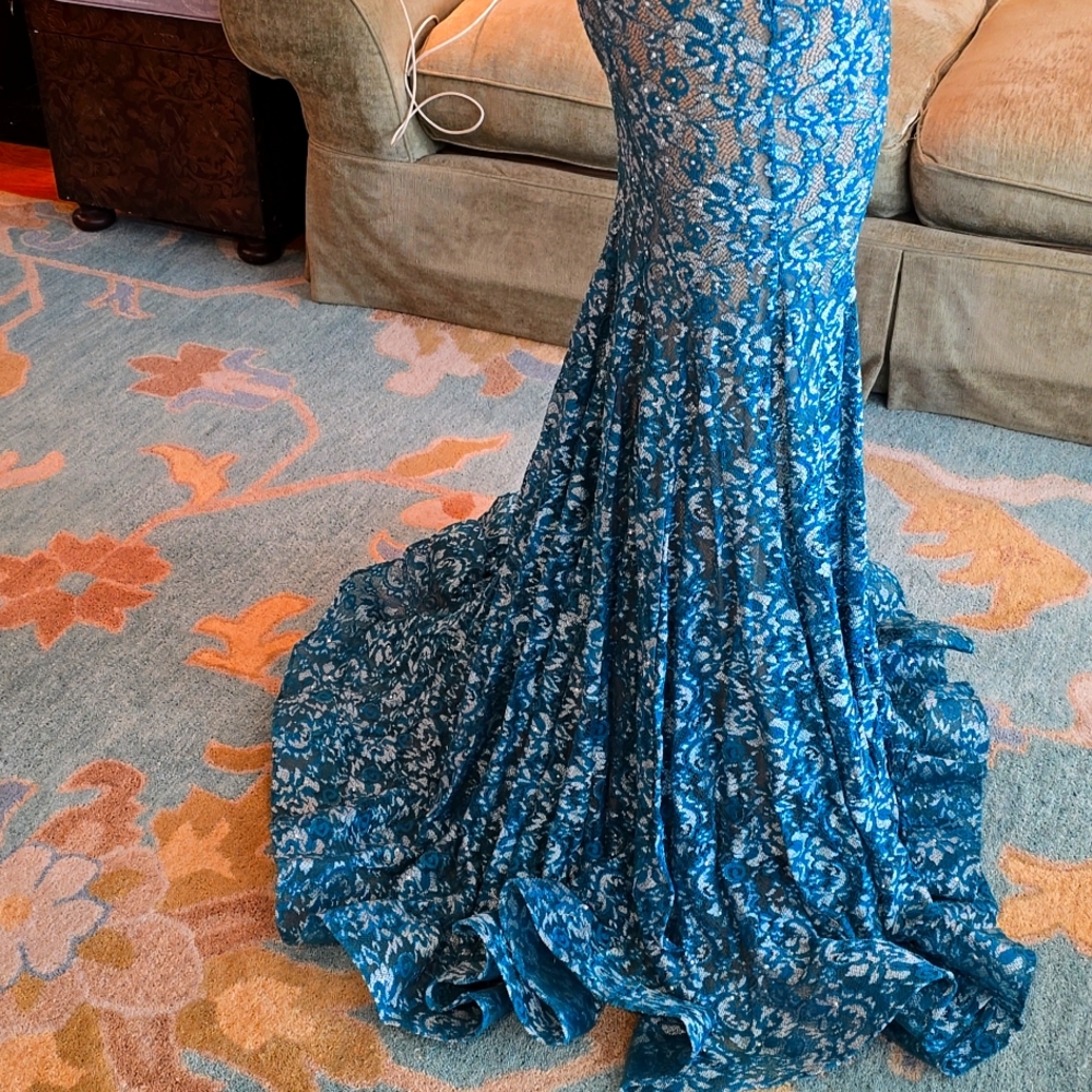 Brand new Jovani teal gown. Never worn!! Stunning detail !! Beautiful train!!